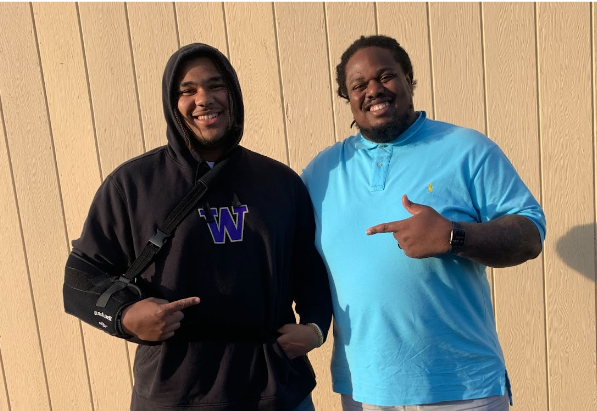 Two gentlemen smiling