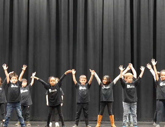 Children performing their dance routine.